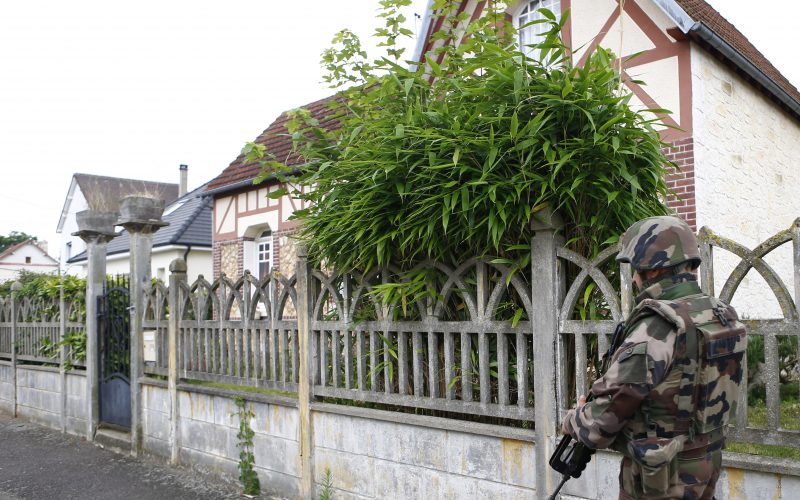 A French soldier stands guard as he prevents access to the scene of the ISIS attack in Saint-Etienne-du-Rouvray Normandy France