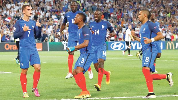 Antoine Griezmann gestures after scoring one of his two goals in Thursday’s semi-final