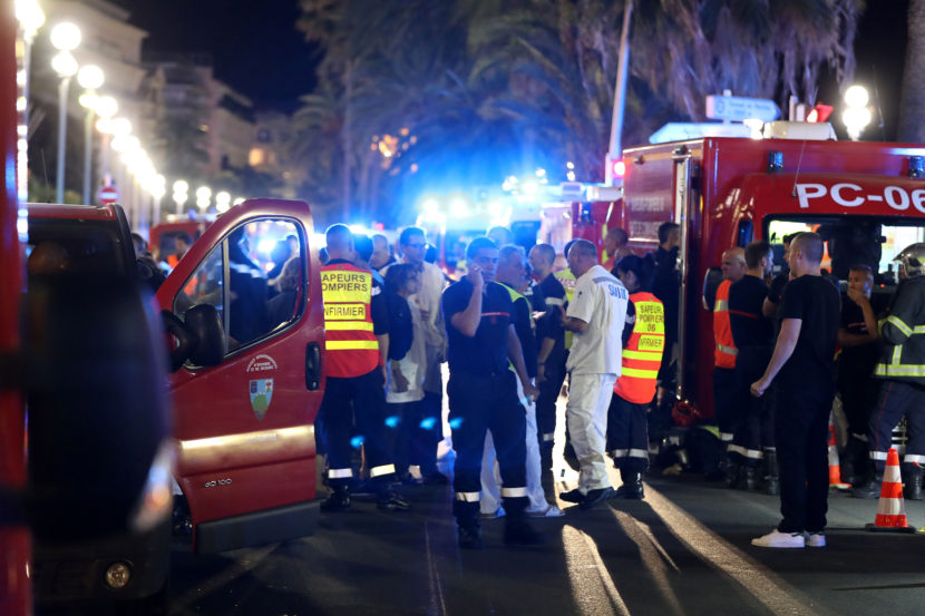 Police officers firefighters and rescue workers at the Promenade des Anglais in Nice after a truck drove into a crowd watching a fireworks display in the French Riviera resort