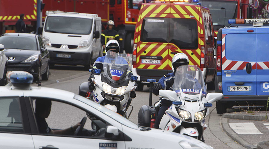 Police and rescue workers work at the scene after two assailants had taken five people hostage in the church at Saint-Etienne-du-Rouvray near Rouen in Normandy France