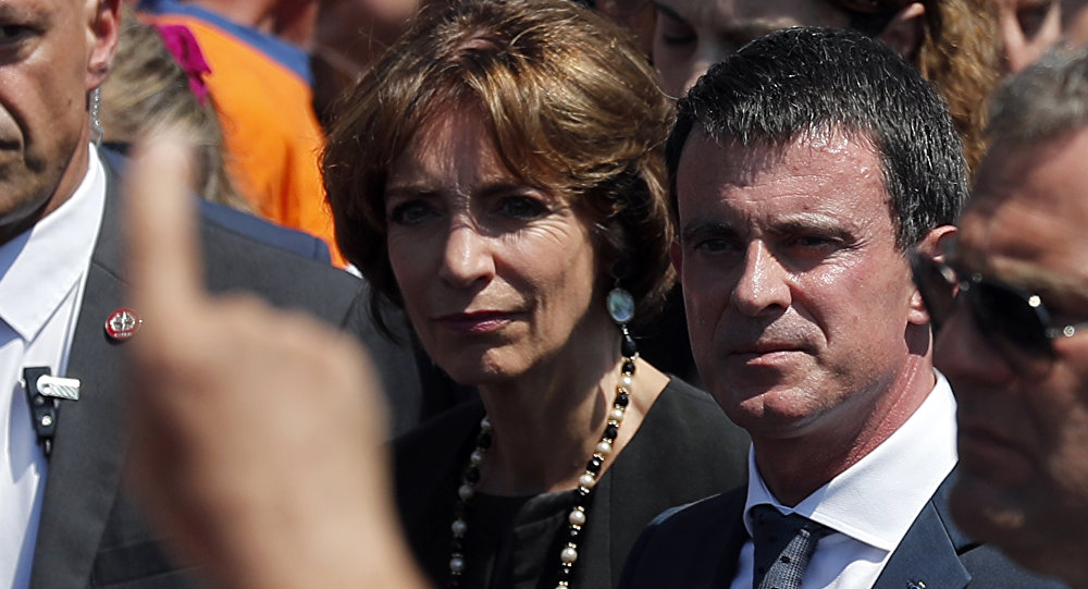 People boo French prime minister Manuel Valls center and Health Minister Marisol Touraine left after a minute of silence on the famed Promenade des Anglais in Nice southern France to honor the victims of an attack near the area where a truck mowed