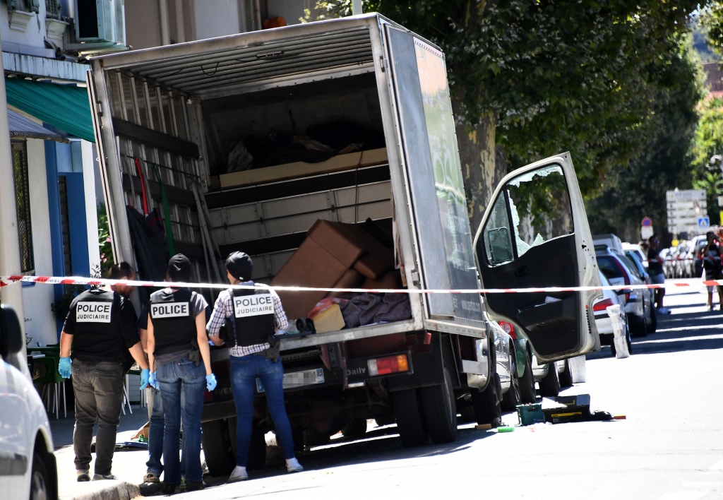 French police officers search a truck in Nice following the terror attack