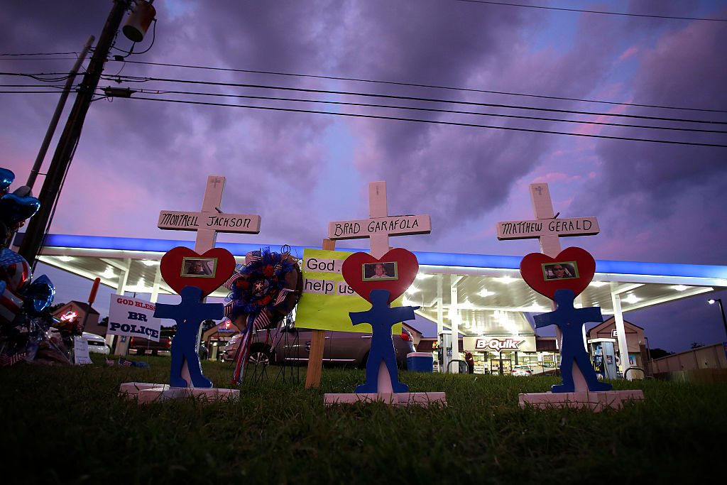 Crosses for Baton Rouge Police Officers Montrell Jackson Matthew Gerald and East Baton Rouge Parish Sheriff Deputy Brad Garafola are displayed at a makeshift memorial outside the B Quik gas station in Baton Rouge