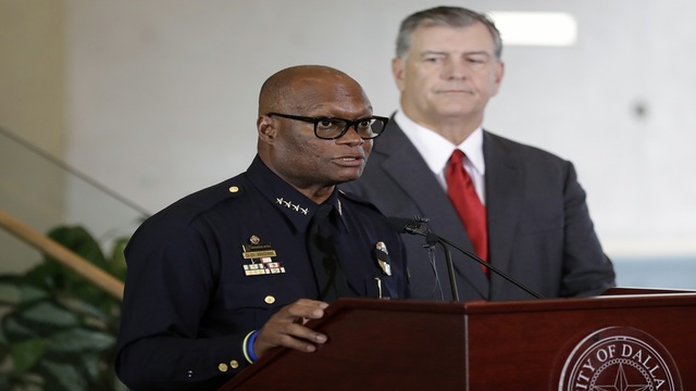 Dallas police chief David Brown left and mayor Mike Rawlings right during a news conference Friday