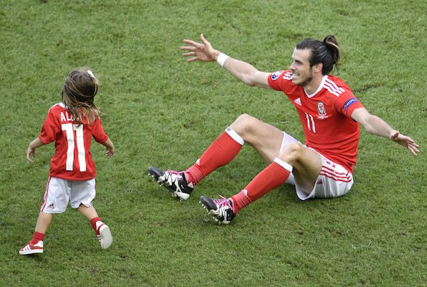 Gareth Bale and his daughter celebrate after the Northern Ireland