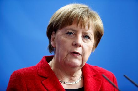 After attacks, Merkel cuts short holiday to face refugee policy storm