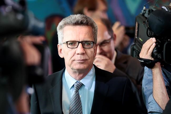 German Interior Minister Thomas de Maiziere arrives for the cabinet meeting at the chancellery in Berlin Germany Wednesday