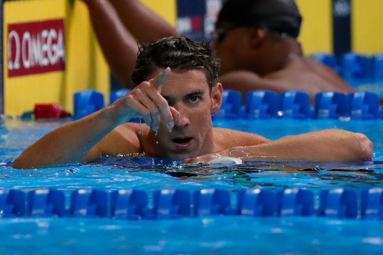 Michael Phelps wins the 100-meter butterfly in what he says was his last race in the United States before retiring for good