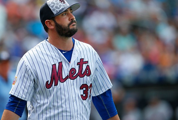 NEW YORK NY- JULY 04 Pitcher Matt Harvey #33 of the New York Mets walks off the field against the Miami Marlins after the second inning during a game at Citi Field