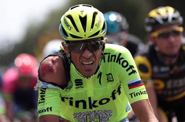 Spain's Alberto Contador is seen injured after a crash during the 188 km first stage of the 103rd edition of the Tour de France cycling race