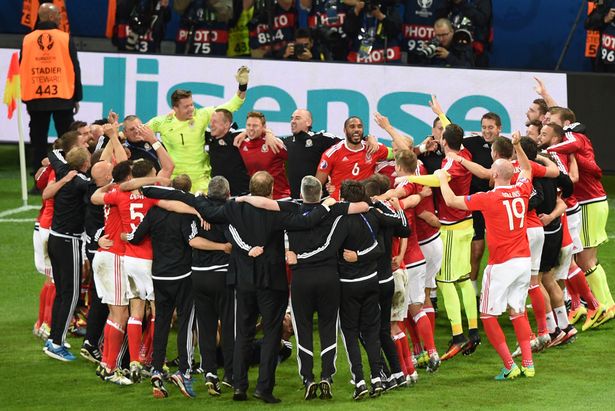 Wales&#039 players celebrate at the end of the Euro 2016 quarter-final