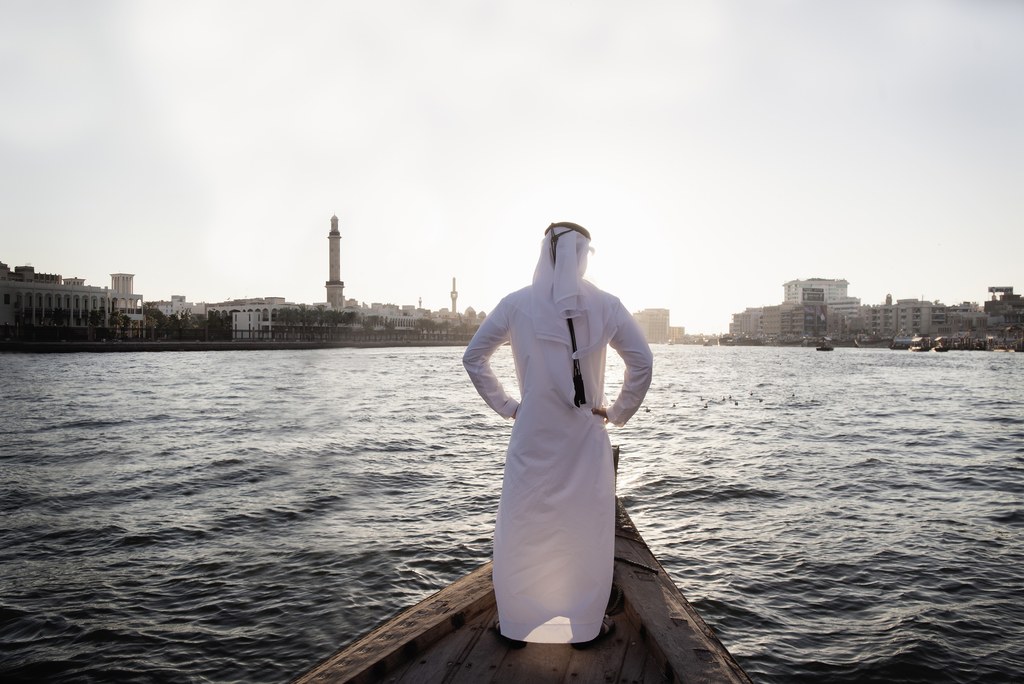 GettyTraditional Emirati dress includes a long white robe and headpiece