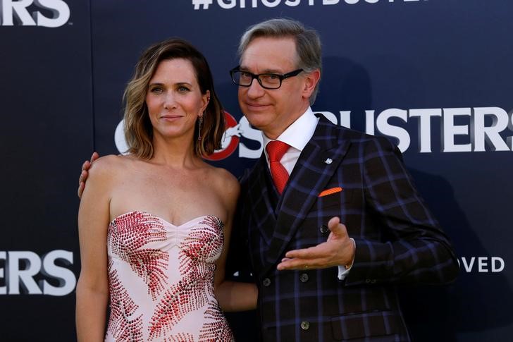 Director Paul Feig poses with cast member Kristen Wiig at the premiere of the film'Ghostbusters in Hollywood California U.S