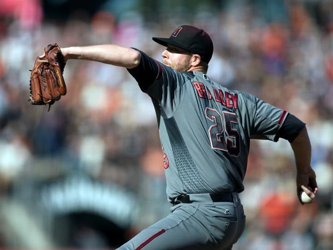 Arizona Diamondbacks starting pitcher Archie Bradley delivers against the San Francisco Giants during the first inning of a baseball game on Sunday