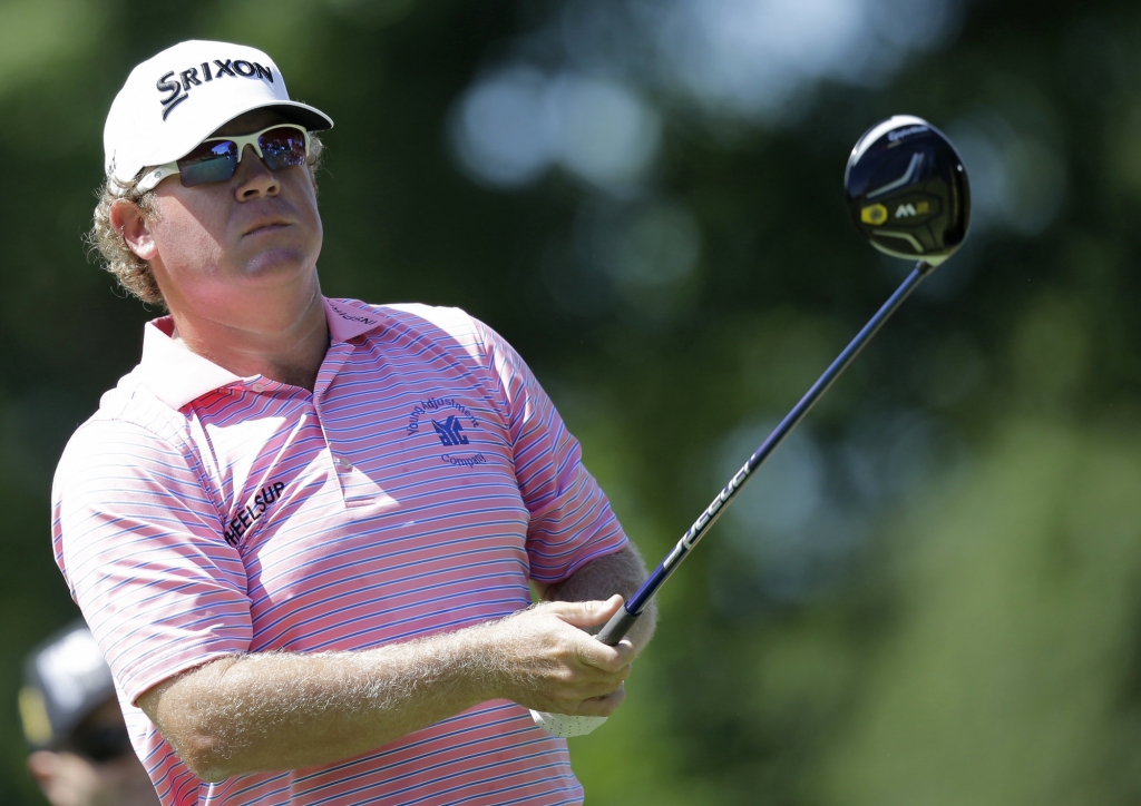 William Mc Girt tees off on the third hole during the first round of the Bridgestone Invitational golf tournament at Firestone Country Club Thursday