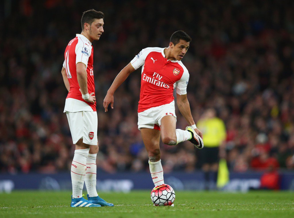 LONDON ENGLAND- APRIL 21 Mesut Ozil and Alexis Sanchez of Arsenal prepare to kick off during the Barclays Premier League match between Arsenal and West Bromwich Albion at the Emirates Stadium