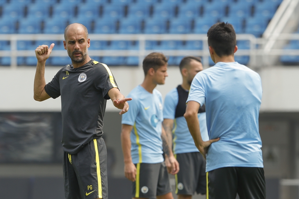 BEIJING CHINA- JULY 24 Manchester City's manager Pep Guardiola gestures during the pre-game training ahead of the 2016 International Champions Cup match between Manchester City and Manchester United at Olympic Sports Center Stadium