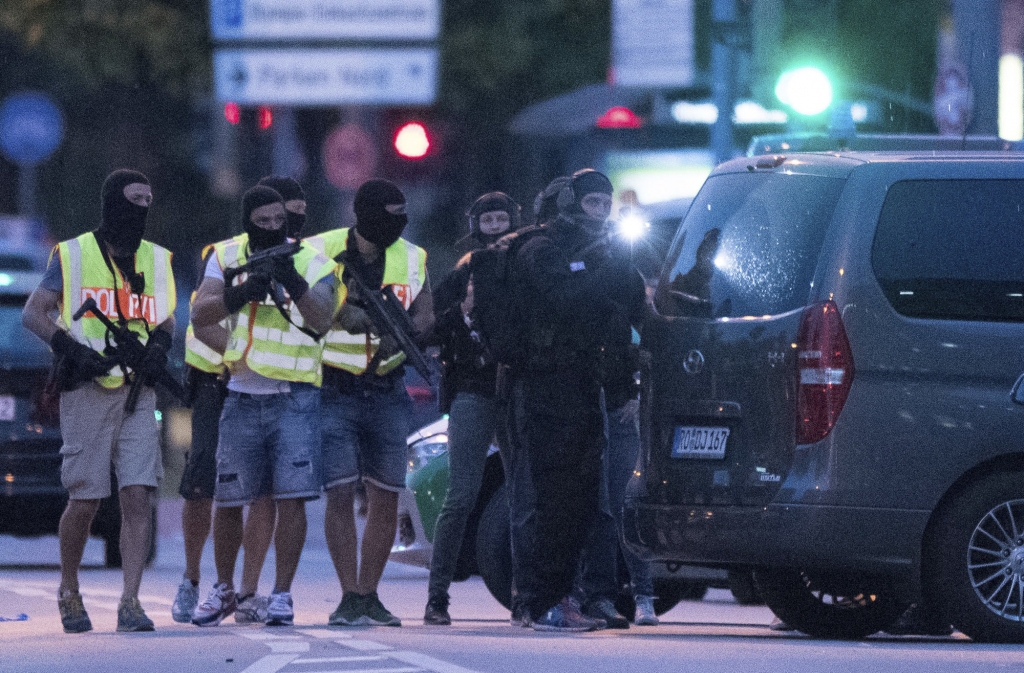 Special police forces prepare to search a neighbouring shopping centre outside the Olympia mall in Munich southern Germany Friday