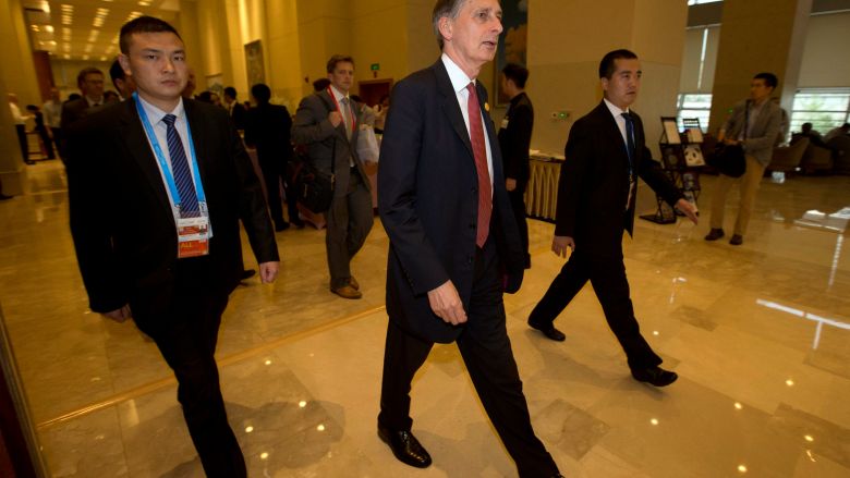 Britain's Chancellor of the Exchequer Philip Hammond walks to a meeting during the G20 Finance Ministers and Central Bank Governors conference held in Chengdu in Southwestern China's Sichuan province