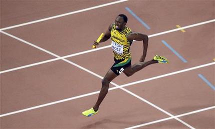 Jamaica's Usain Bolt right anchors the Jamaican team to the finish line as Jamaica wins the men's 4x100 meter relay final at the World Athletics Championships in Beijing. Jamaican officials say Bolt has