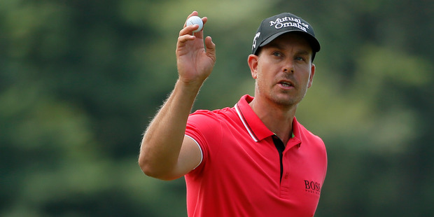 Henrik Stenson waves to the crowd after his putt on the 18th hole during the second round of the PGA Championship golf tournament