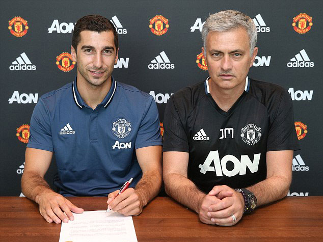 Henrikh Mkhitaryan and manager Jose Mourinho during the signing of his Manchester United contract