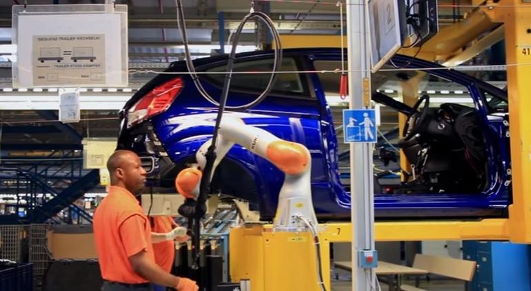 Here's a look at a collaborative robot working with a human to install shock absorbers in a Ford Fiesta