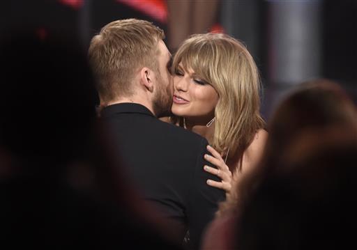 Taylor Swift right hugs Calvin Harris after winning the award for top billboard 200 album for'1989 at the Billboard Music Awards at the MGM Grand Garden Arena in Las Vegas. Swift has confirmed that she co-wrote ex-boyf