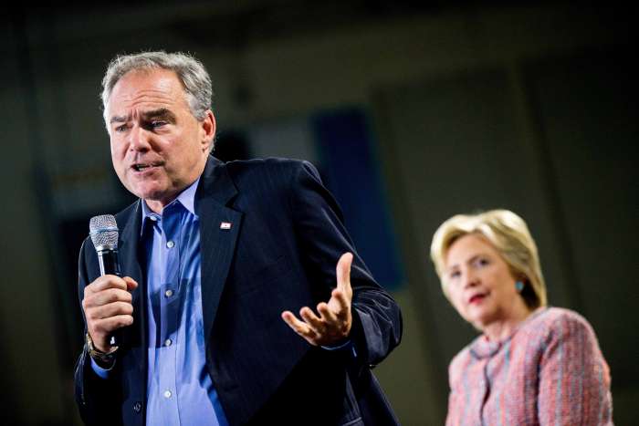 Democratic presidential candidate Hillary Clinton right listens as Sen. Tim Kaine D-Va. speaks at a rally at Northern Virginia Community College in Annandale Thursday