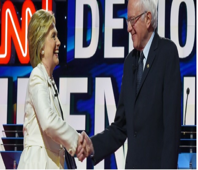 Hillary Clinton In Handshake With Senator Bernie Sanders