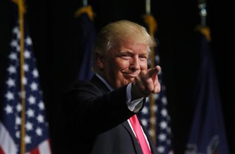 Republican presidential candidate Donald Trump points to the crowd after speaking during a campaign rally at Lackawanna College Wednesday