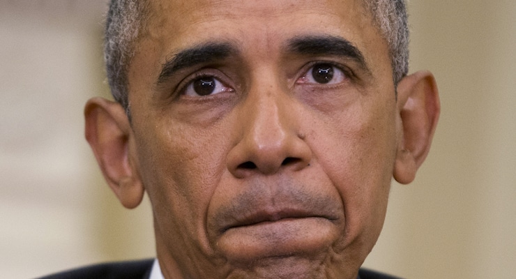 President Barack Obama pauses while speaking to members of the media in the Oval Office of the White House in Washington on Monday