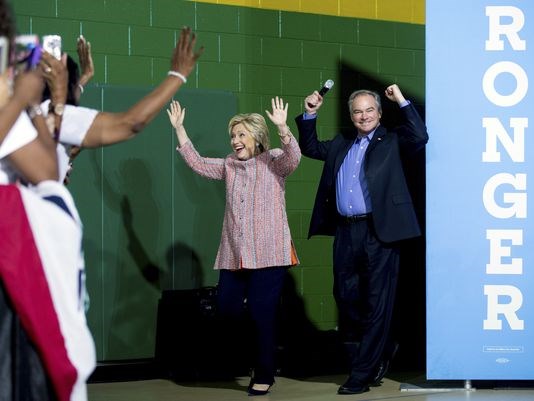 Democratic US presidential candidate Hillary Clinton and US Senator Tim Kaine attend a campaign rally at the Ernst Community Cultural Centre in Annandale Virginia