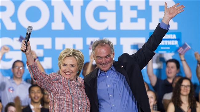 14 2016 shows US Democratic presidential candidate Hillary Clinton and US Senator Tim Kaine Democrat of Virginia waving during a campaign rally in Annandale Virginia