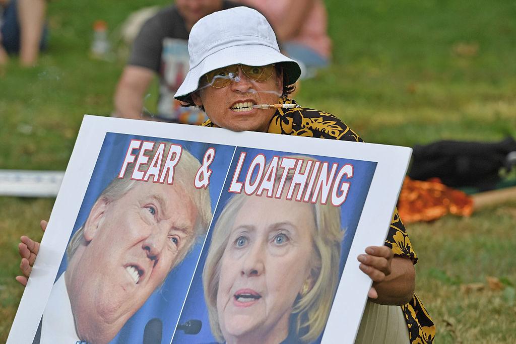 PHILADELPHIA PA- JULY 24 A man dressed like author Hunter S. Thompson holds a sign before the start of the Democratic National Convention