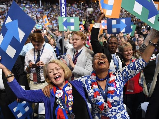 Hillary Clinton supporters from Arkansas cheer during the 2016 Democratic National Convention in Philadelphia