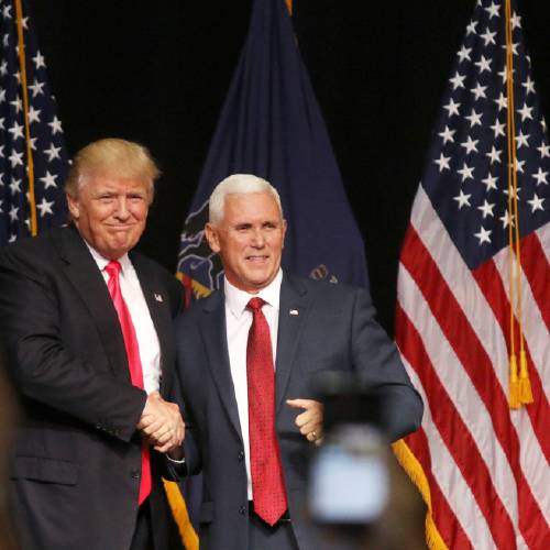 Donald Trump left and Vice president candidate Indiana Gov. Mike Pence shake hands during a campaign stop in Lackawanna College Student Union in Scranton Pa. Wednesday