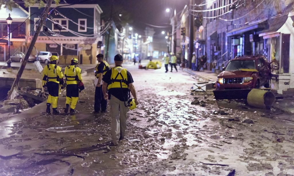 Image Officials assess damage along Main Street in Old Ellicott City