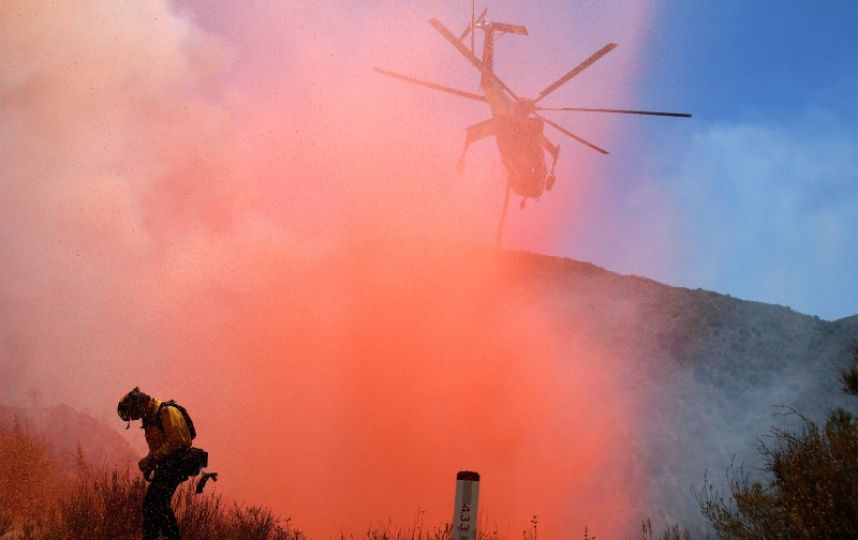 Los Angeles-area wildfire spreads, motorist found dead