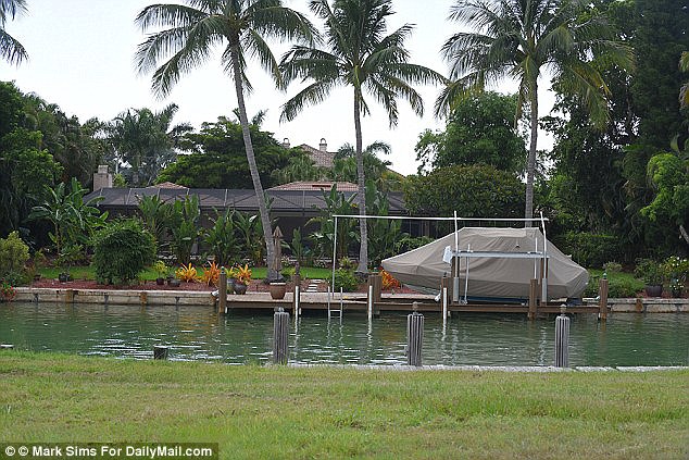 Hot property Police say Derwin crashed Palmer's boat a 23-foot vessel seen here last August outside his Marco Island Florida home