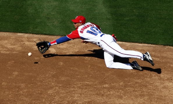 SAN DIEGO- MARCH 15 Yulieski Gourriel #10 of Cuba dives for a ground ball during the 2009 World Baseball Classic Round 2 Pool 1 match