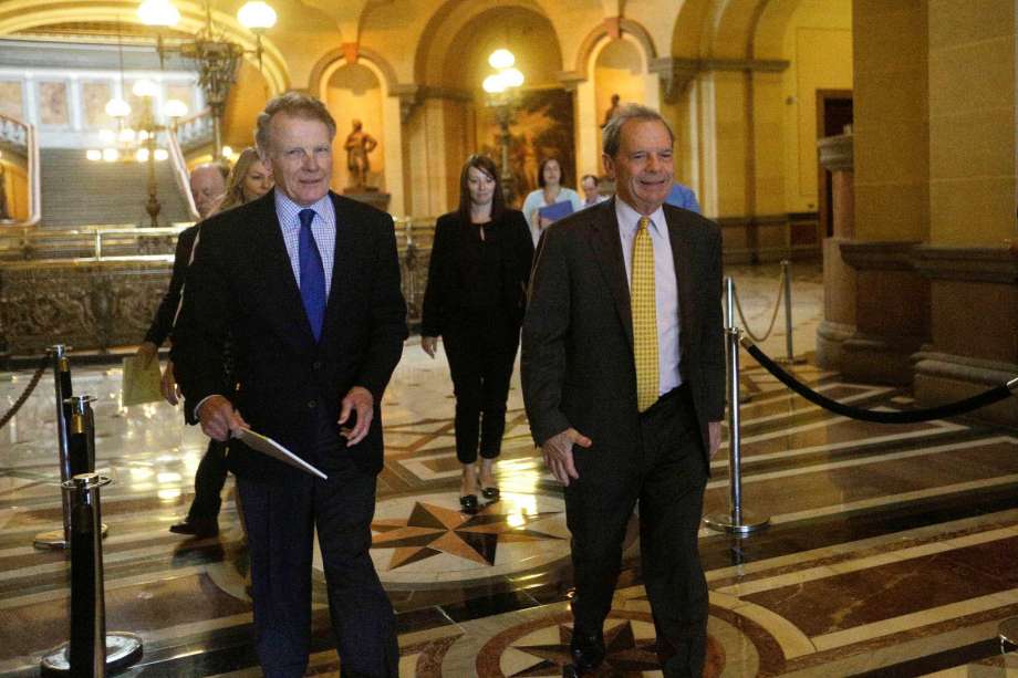 Illinois Speaker of the House Michael Madigan D-Chicago left and Illinois Senate President John Cullerton D-Chicago right enter Illinois Gov. Bruce Rauner's office at the Illinois State Capitol Tuesday