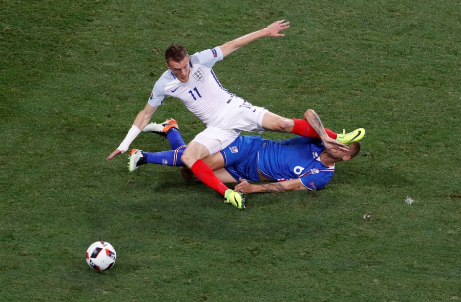 Iceland's Ragnar Sigurdsson in action with England's Jamie Vardy.   
  Credit    Yves Herman  Reuters  Livepic