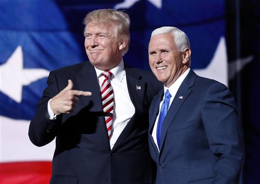 Republican presidential candidate Donald Trump points toward Republican vice presidential candidate Indiana Gov. Mike Pence after Pence's acceptance speech during the third day session of the Republican National Convention in Cleveland Wednesday J