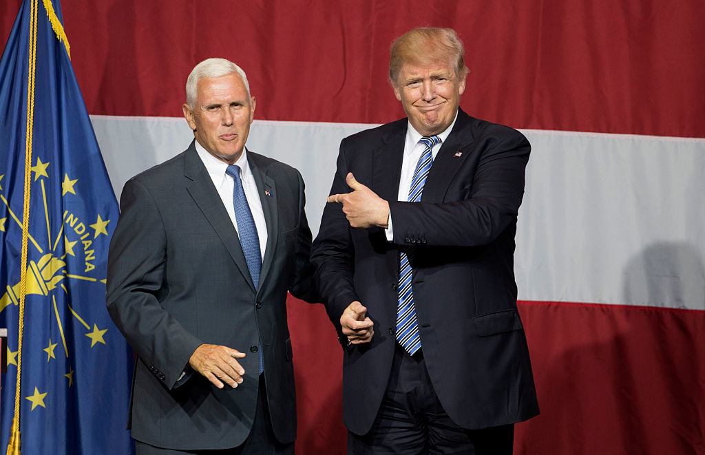 Presumptive US Republican presidential candidate Donald Trump and Indiana Governor Mike Pence take the stage during a campaign rally at Grant Park Event Center in Westfield Indiana