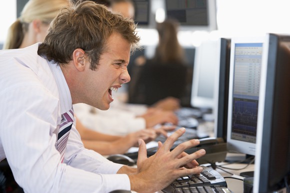 Frustrated Stock Trader In Front Of Computer Screen Getty