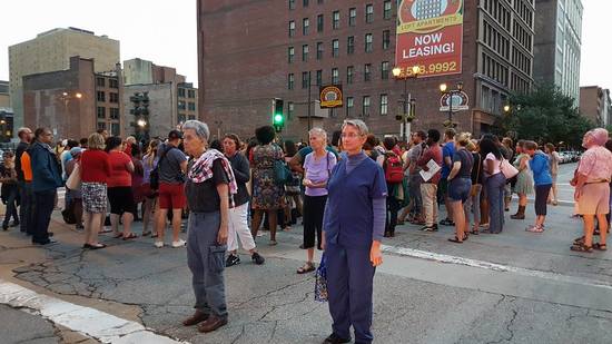 In a symbolic these two women hold the police at bay.

1