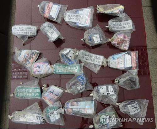 South Korean military on July 27 2016 vinyl bags carrying North Korean leaflets are displayed on a table