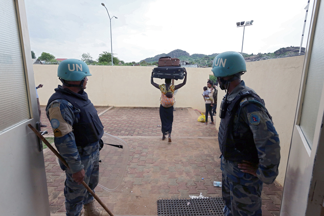 13 2016 and released by the United Nations Mission in South Sudan, villagers are led by UN soldiers to the UN