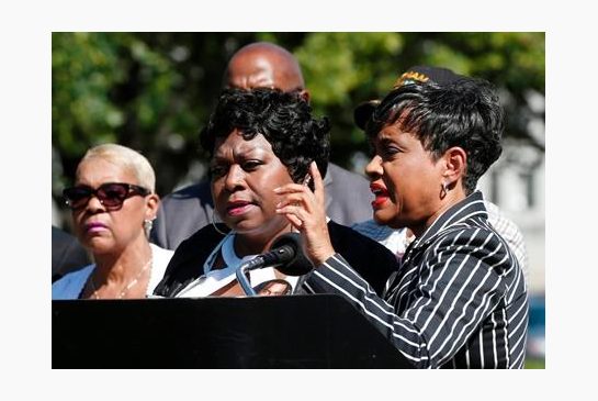 TV Judge Glenda Hatchett right speaks as Valerie Castile the mother of Philando Castile listens during a news conference on the State Capitol grounds Tuesday